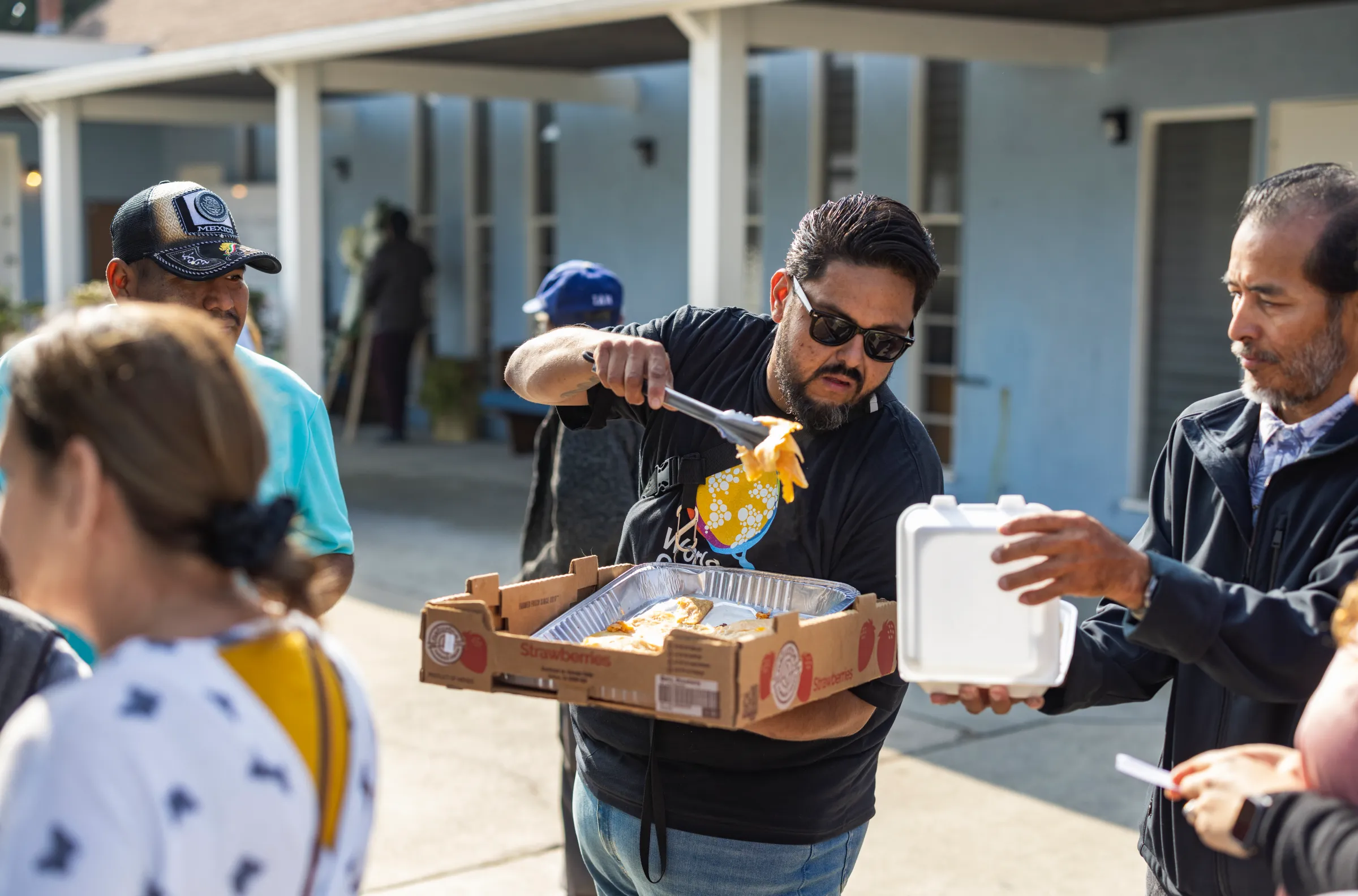 An image of a man service food to a civilian